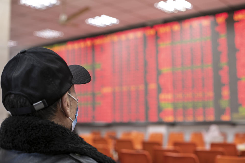 An investor watches an electric screen displaying stock price figures at a stock exchange hall in Shanghai, China. Photo: VCG/VCG via Getty
