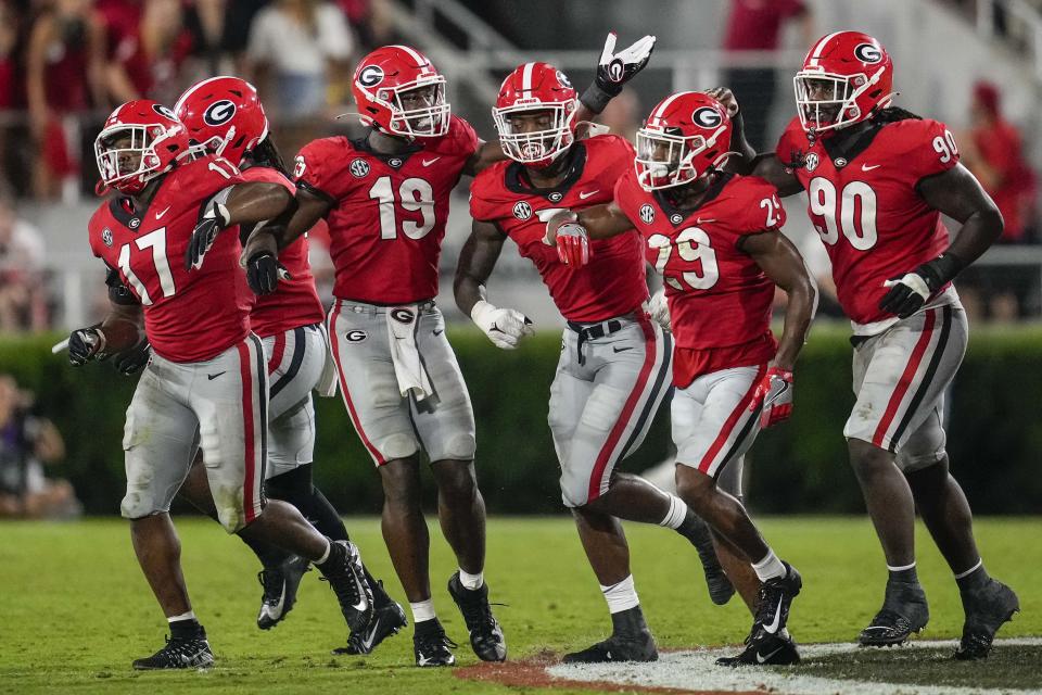 Sep 18, 2021; Athens, Georgia, USA; Georgia Bulldogs linebacker Quay Walker (middle) celebrates with teammates after recovering a fumble against the South Carolina Gamecocks during the second half at Sanford Stadium. Mandatory Credit: Dale Zanine-USA TODAY Sports