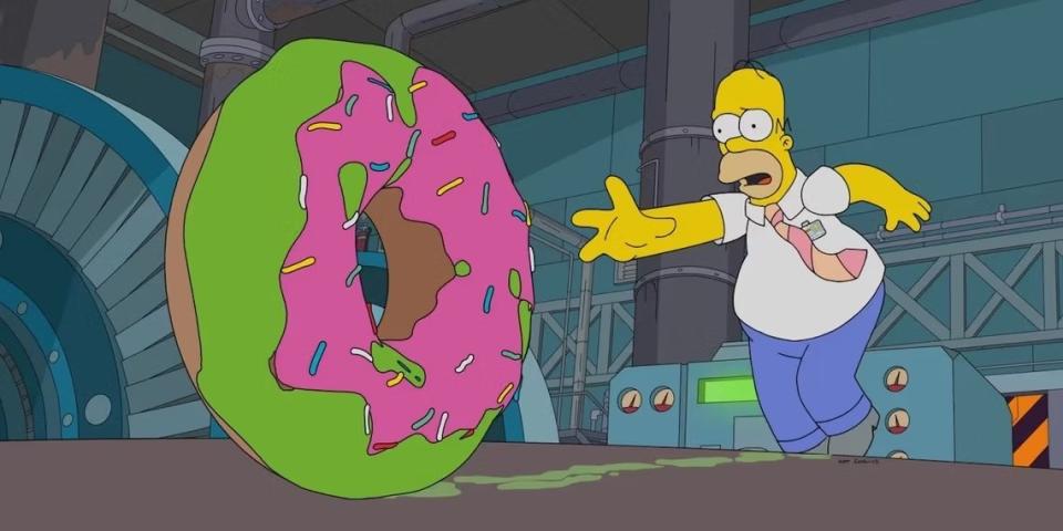 Homer chases a rolling green and pink donut on The Simpsons: Treehouse of Horror XXXIV