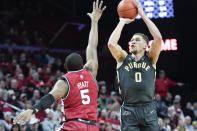 Purdue forward Mason Gillis (0) shoots a three-point basket over Rutgers forward Aundre Hyatt (5) in the first half of an NCAA college basketball game, Sunday, Jan. 28, 2024, in Piscataway, N.J. (AP Photo/Mary Altaffer)