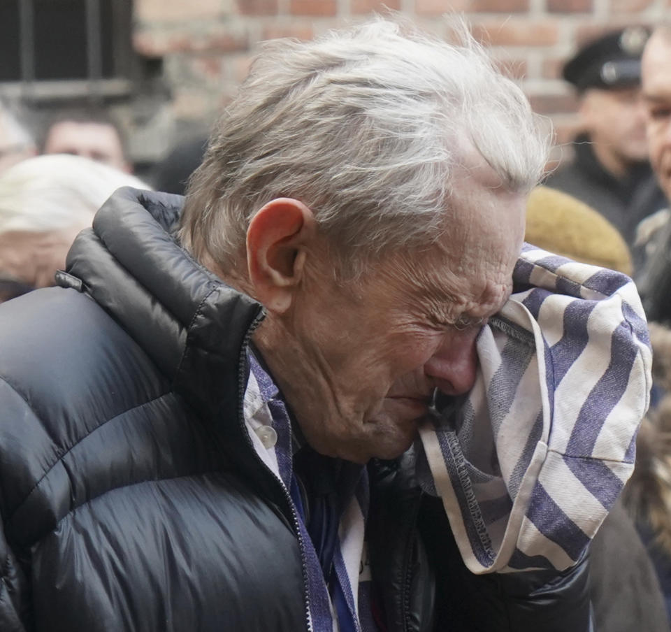 Many survivors wore striped garments at Monday's commemoration ceremony at Auschwitz to symbolise the clothes they wore there as prisoners.