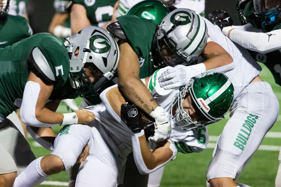 Provo’s Drew Deucher is tackled in the football game against Olympus at Olympus High School in Holladay on Friday, Aug. 18, 2023. | Megan Nielsen, Deseret News