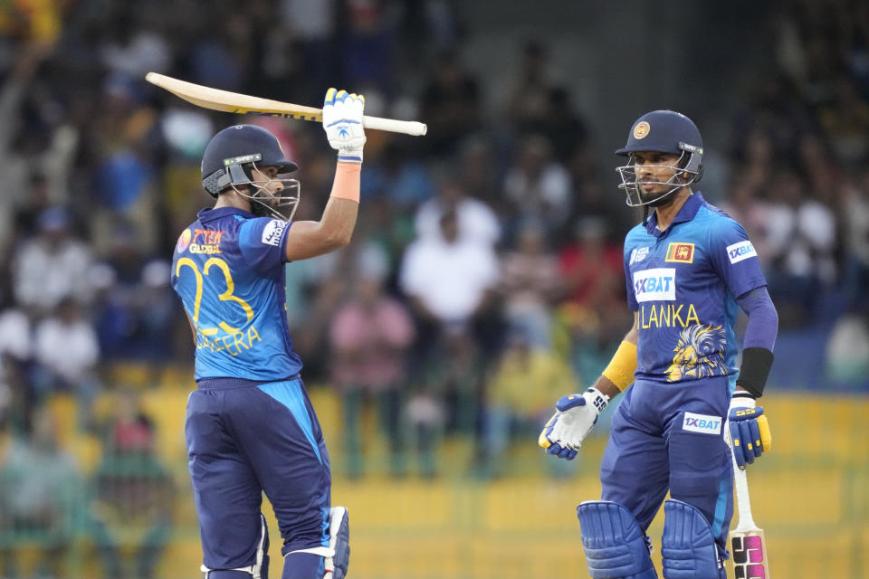 Sri Lanka's Sadeera Samarawickrama, left, celebrates his half century as Dasun Shanaka watches during the Asia Cup cricket match between Sri Lanka and Bangladesh in Colombo, Sri Lanka on Saturday, Sep. 9. (AP Photo/Eranga Jayawardena)