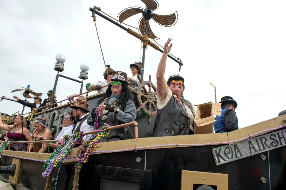 Revelers take in the festivities during the Krewe of Wrecks Mardi Gras Parade at Pensacola Beach Sunday, February 27, 2022.