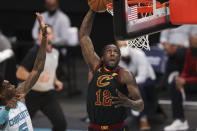 Cleveland Cavaliers forward Taurean Prince (12) dunks against the Charlotte Hornets during the second quarter of an NBA basketball game in Charlotte, N.C., Wednesday, April 14, 2021. (AP Photo/Nell Redmond)