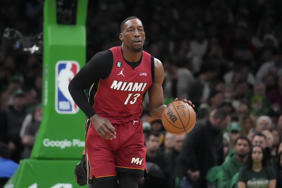 Miami Heat center Bam Adebayo (13) moves the ball down court in the first half of game 1 of the NBA basketball Eastern Conference finals playoff series against the Boston Celtics in Boston, Wednesday, May 17, 2023. (AP Photo/Charles Krupa)