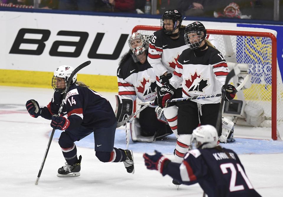 United State’s Brianna Decker (14)celebrates her goal during the second period of a IIHF Women’s World Championship hockey tournament game against Canada, Friday, March 31, 2017, in Plymouth, Mich. In the background right is Canada forward Blayre Turnbull. (Jason Kryk/The Canadian Press via AP)