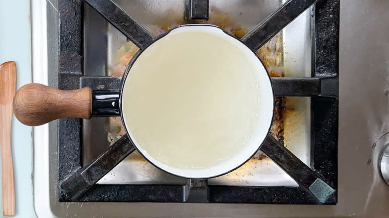 Water simmering in saucepan on stovetop