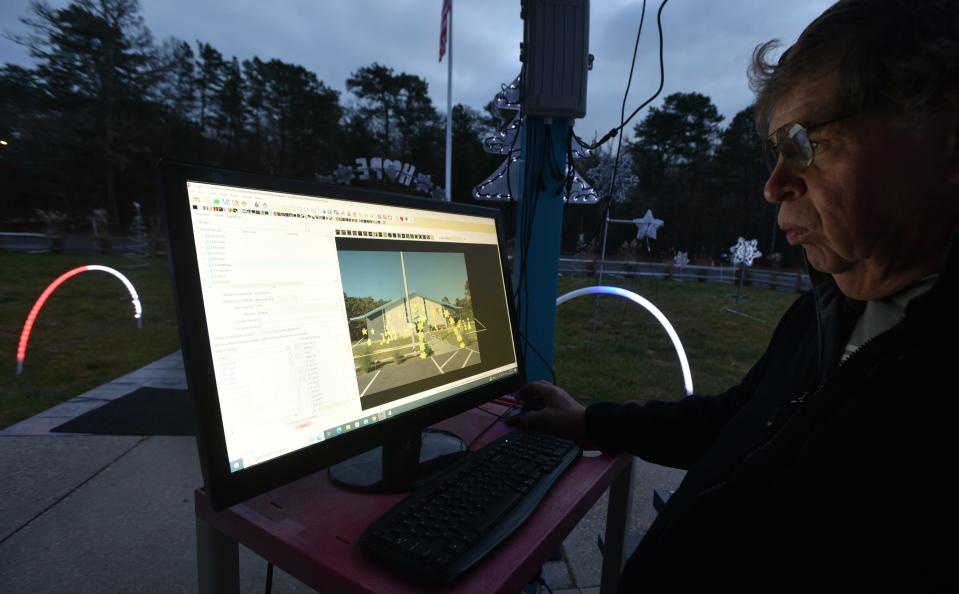 Gary Guidi runs all 30,000 of his LED light setups from a computer with a program that can control each light and its color for the Cape Cod Children's Museum first annual Holiday Lights display in Mashpee. The drive-through event is open Friday and Saturday nights through the month and on Dec. 23.