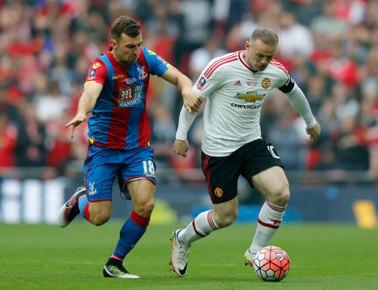 Crystal Palace's midfielder James McArthur (L) vies with Manchester United's striker Wayne Rooney during the English FA Cup final football match in London on May 21, 2016