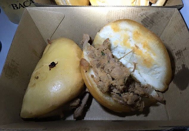 This is one of the meals, believed to be a pork burger, that was served to customers who paid $400 for a ticket. Photo: Facebook/Chris Lee