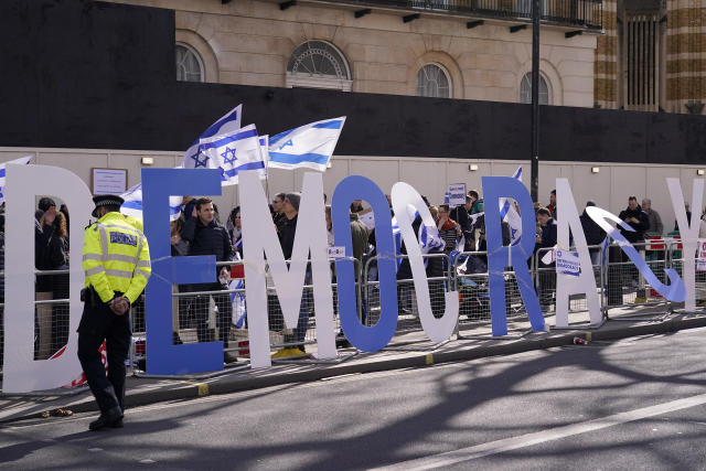 Protestors demand democracy during the visit of Israeli Prime Minister Benjamin Netanyahu to 10 Downing Street in London, Friday, March 24, 2023.(AP Photo/Alberto Pezzali)