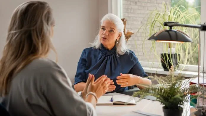 A financial advisor meets with an unhappy client. 