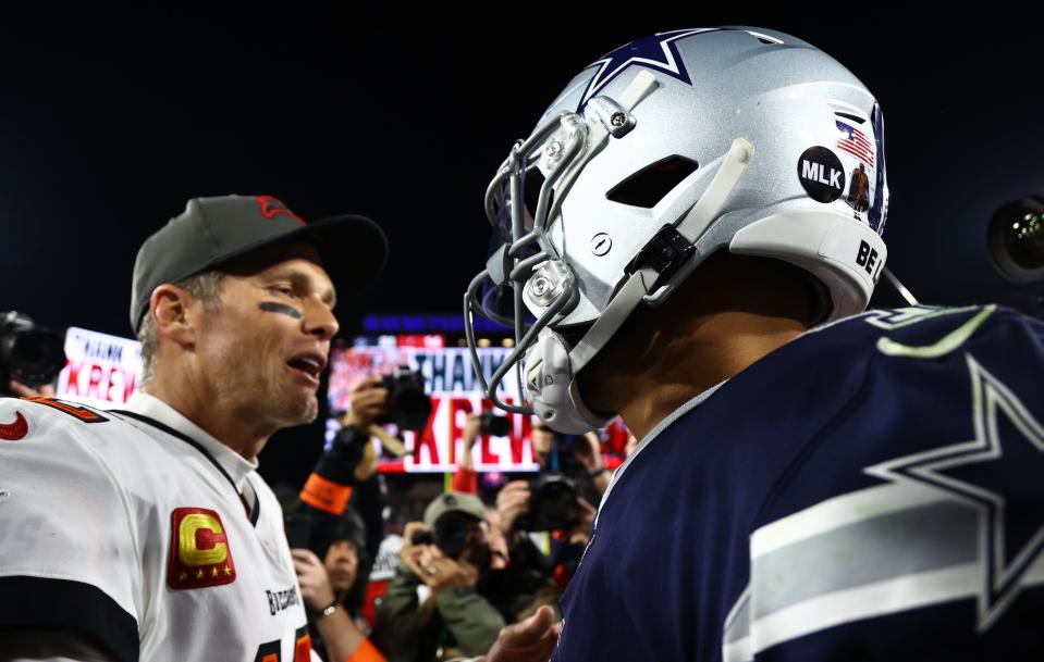 Jan 16, 2023; Tampa, Florida, USA; Dallas Cowboys quarterback Dak Prescott (4) and Tampa Bay Buccaneers quarterback Tom Brady (12) meet after the wild card game at Raymond James Stadium. Mandatory Credit: Kim Klement-USA TODAY Sports