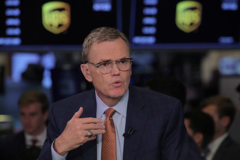 FILE PHOTO: David Abney, chairman and CEO of United Parcel Service (UPS), speaks during an interview with CNBC on the floor at the NYSE in New York
