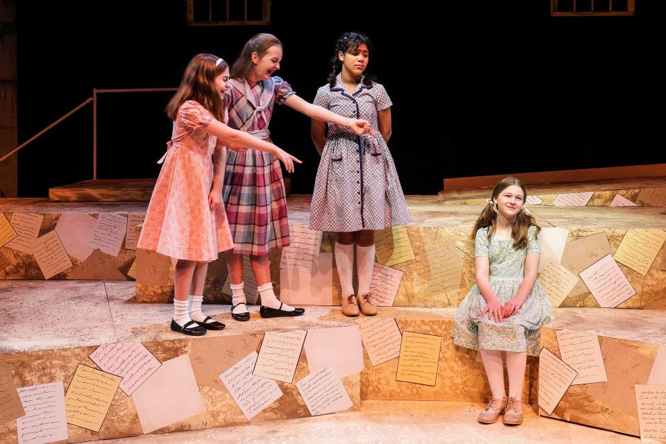 "The Hundred Dresses," based on the Newbery Medal book by Eleanor Estes, deals with being a bully and allowing someone else to be a bully. The Des Moines Playhouse cast (left to right) includes Annie White, Julia Neighbors, Bianca Elliott, and Haddy Dixon. The Hundred Dresses is Feb. 24-Mar. 12 in The Kate Goldman Children’s Theatre at The Des Moines Playhouse.
