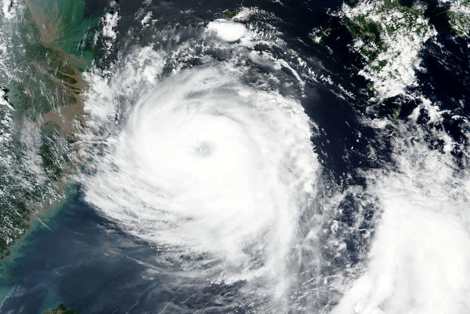 This Aug. 25, 2020, satellite image released by NASA shows Typhoon Bavi near South Korean island of Jeju. Typhoon Bavi as of Wednesday morning was near the South Korean island of Jeju and was on course to hit the northwest coast of the Korean Peninsula around daybreak Thursday morning. South Korea's weather agency said it had a maximum wind speed of 155 kilometers per hour (96 mph) and was forecast as one of the strongest to hit the peninsula this year. (NASA Worldview, Earth Observing System Data and Information System (EOSDIS) via AP)