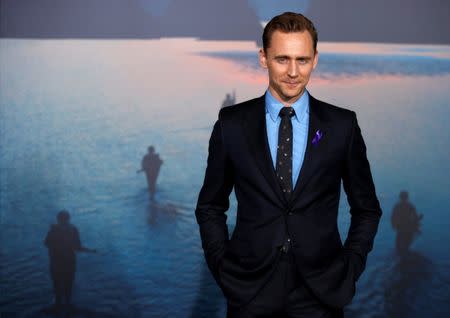 FILE PHOTO: Cast member Tom Hiddleston poses at the premiere of "Kong: Skull Island" in Los Angeles, California, U.S. March 8, 2017. REUTERS/Mario Anzuoni