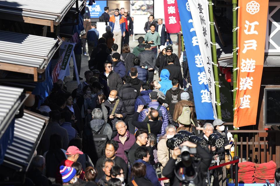 Visitors are packed newly opened "Toyosu Senkyaku Banrai," an Edo Period-themed hot spring complex on opening day at Toyosu Fish Market Thursday, Feb. 1, 2024, in Tokyo. Japan's biggest fish market on Thursday opened a long-awaited outer section with Japanese-style seafood restaurants and a spa for relaxation, as the wholesale venue that has struggled since relocating from the beloved Tsukiji market seeks to lure more visitors. (AP Photo/Eugene Hoshiko)