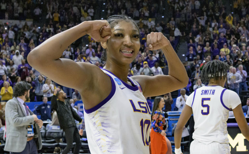 FILE - LSU forward Angel Reese (10) reacts after LSU defeated Michigan in a second-round college basketball game in the women's NCAA Tournament in Baton Rouge, La., Sunday, March 19, 2023. Reese was named to the preseason AP All-America women’s NCAA college basketball team, revealed Tuesday, Oct. 24, 2023. (AP Photo/Matthew Hinton, File)