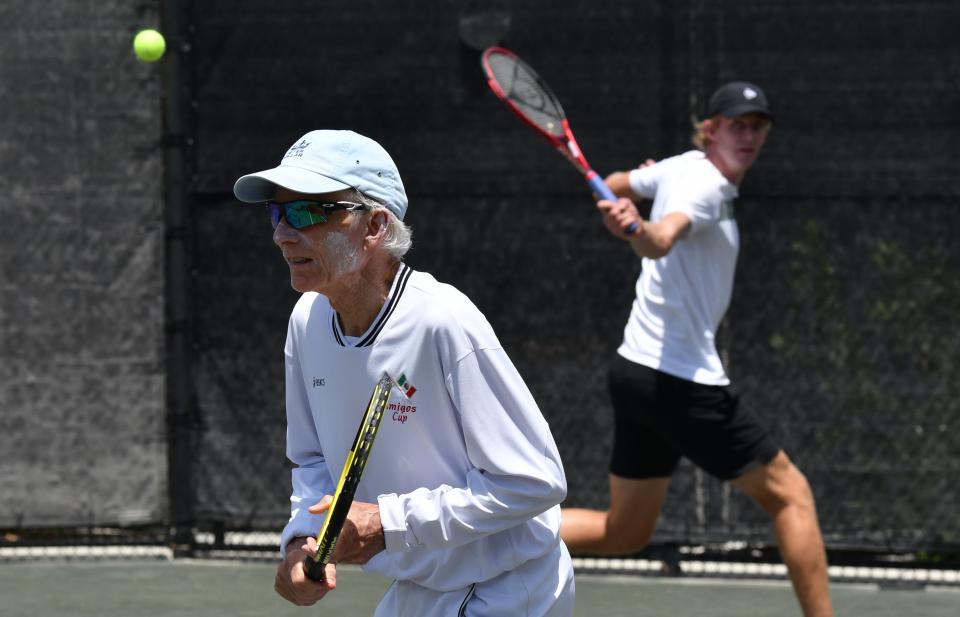 Tennis enthusiast Jamie Pressly, left, joins current ATP pro Kevin Anderson for a few volleys to raise money for First Serve USA.