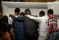 Mourners pay their respects at the casket of Freddie Gray before his funeral at New Shiloh Baptist Church on April 27, 2015 in Baltimore