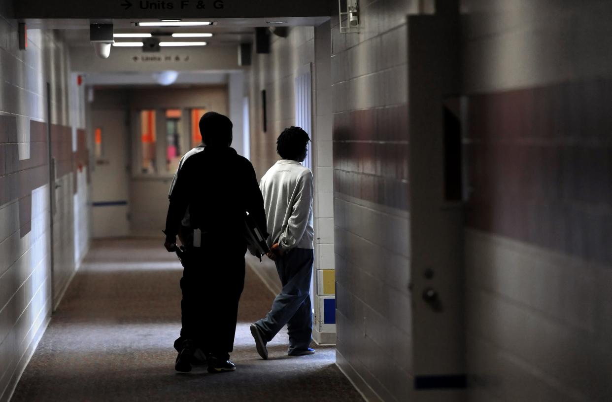 Students are escorted through the halls of the Marion County Juvenile Detention Center in Indianapolis.