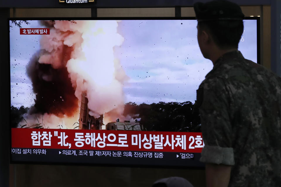 A South Korean soldier watches a TV screen showing a news program reporting about North Korea's firing projectiles with a file image at the Seoul Railway Station in Seoul, South Korea, Saturday, Aug. 24, 2019. North Korea fired two suspected short-range ballistic missiles off its east coast on Saturday in the seventh consecutive week of weapons tests, South Korea’s military said, a day after it threatened to remain America’s biggest threat in protest of U.S.-led sanctions on the country. The Korean letters on TV read: "North Korea fired projectiles." (AP Photo/Lee Jin-man)