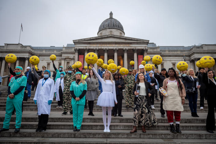 A crowd of almost 100 workers comprising 11 different sectors hold emoji-shaped balloons to  illustrate new insights from Indeed&#xe2;&#x80;&#x99;s &#xe2;&#x80;&#x98;Work Happiness Score&#xe2;&#x80;&#x99;, the world&#xe2;&#x80;&#x99;s largest study of work happiness. The event acts as a stark warning to employees and employers of the scale of unhappiness across the nation, as the data shows that over a third of the UK&#xe2;&#x80;&#x99;s workforce is unhappy in their job. The study, which has been developed with guidance from the Wellbeing Research Centre at Oxford University, found that real estate, management and consulting and the automotive industries are the unhappiest, while education, aerospace and defence and the media are the countries happiest (SWNS)