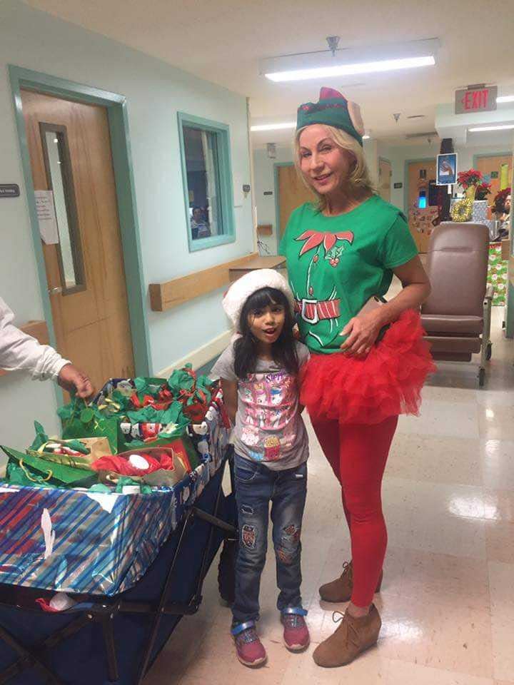 Some of the Oak Island Angels deliver gifts at a nursing home in Southport.