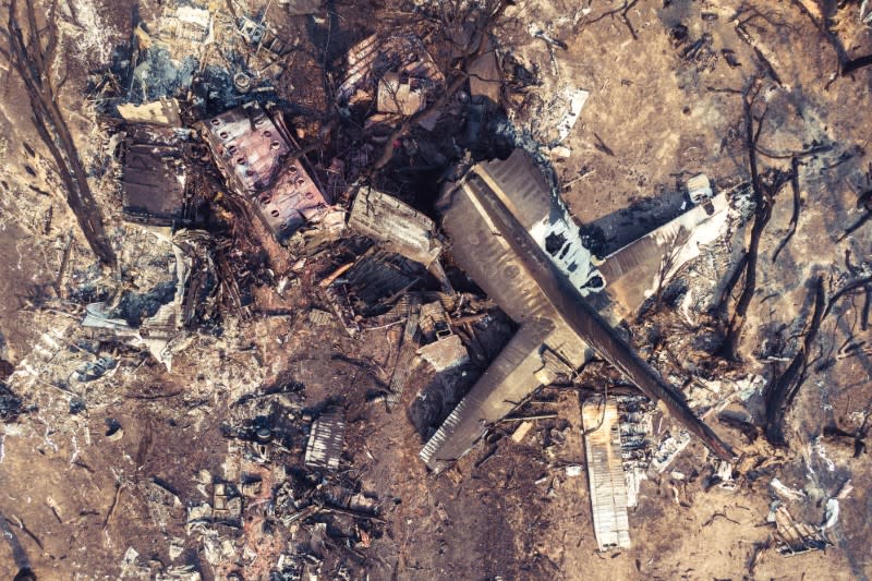 Debris seen following the crash of a C-130 air tanker plane after dropping fire retardant, in this January 24, 2020 picture obtained from social media, in Snowy Mountains, New South Wales, Australia