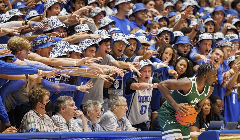 Duke students try to district Jacksonville University sophomore Gyasi Powell as he inbounds the ball during Monday's at the Cameron Indoor Arena.
