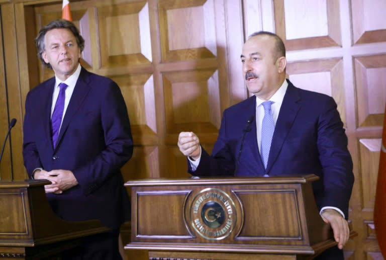 Turkey's Foreign Minister Mevlut Cavusoglu (R) and Netherlands Foreign Minister Bert Koenders speak during a joint press conference at the Foreign Ministry's residence in Ankara on August 29, 2016