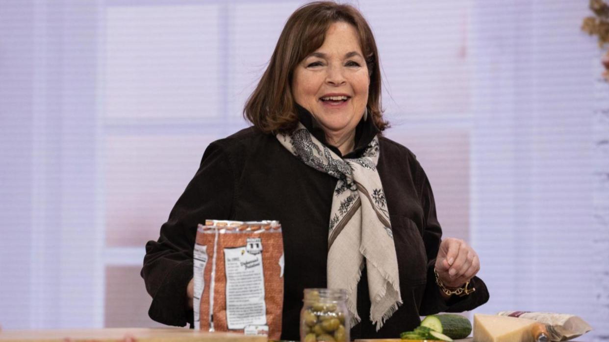 Ina Garten smiling over her cooking station.