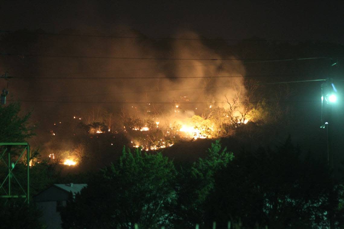 A hillside near the intersection of US 180 and Highway 16 in Strawn is on fire at on April 15, 2011. Grass fires and strong winds burnt many homes and acreage west of Fort Worth near Graham, Texas in the Possum Kingdom Lake area.