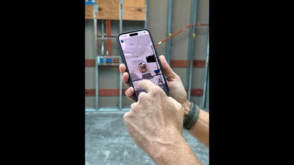 As part of a topping off ceremony at the construction site of the new UHealth at SoLé Mia center in North Miami, guests were given a tour of the building. In one of the rooms, people could scan a QR code for an AR experience showing what one of the operating rooms would look like.