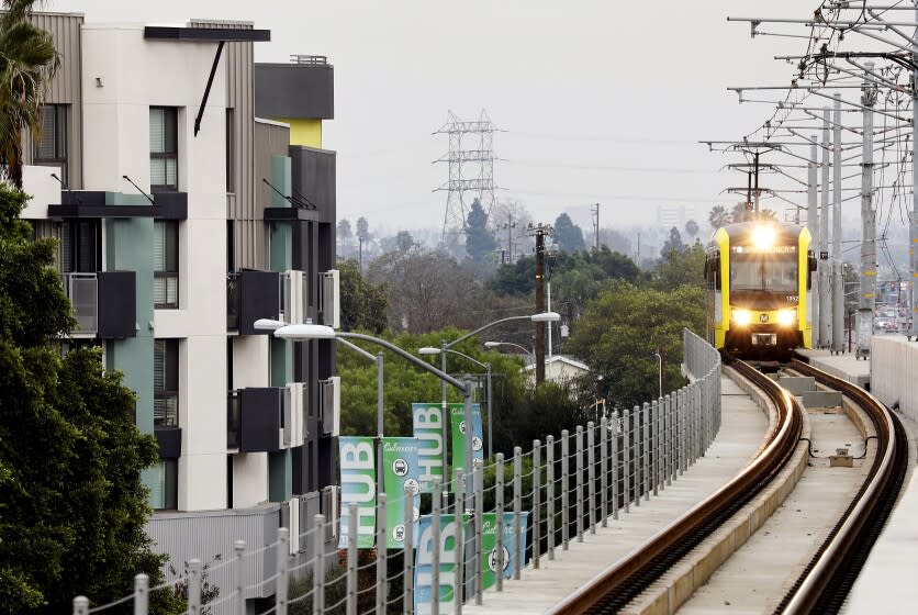 CULVER CITY-CA-JANUARY 3, 2017: A Metro train passes by apartments in Culver City on Wednesday, January 3, 2017. (Christina House / Los Angeles Times)