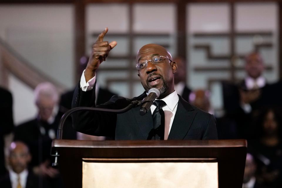 Sen. Raphael Warnock, D-Ga., a senior pastor at Ebenezer Baptist Church, speaks at the church.