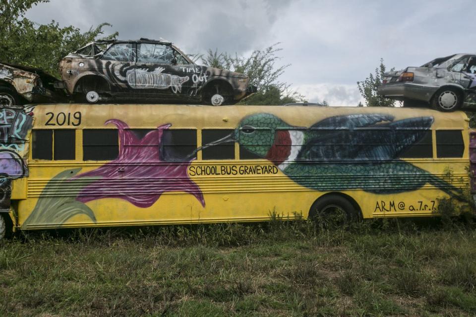 Alonzo Wade opened a used cars and parts business in Alto in 1959. The business sold buses as well as bus parts. However, vandals started breaking in to steal the radiators out of the buses. That led Wade to construct a makeshift fence using the buses themselves.