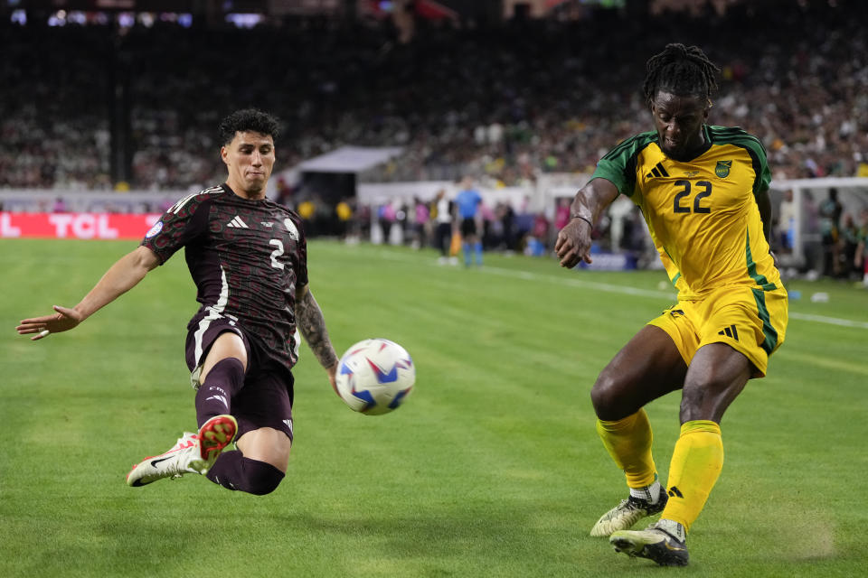 Mexico's Jorge Sanchez, left, tries block a shot by Jamaica's Greg Leigh during a Copa America Group B soccer match in Houston, Saturday, June 22, 2024. (AP Photo/Kevin M. Cox)