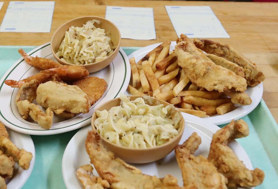 Fried fish and shrimp are ready to be served to patrons during the fish fry at the Polish American Club Friday, Feb. 26, 2021 in Akron, Ohio.
