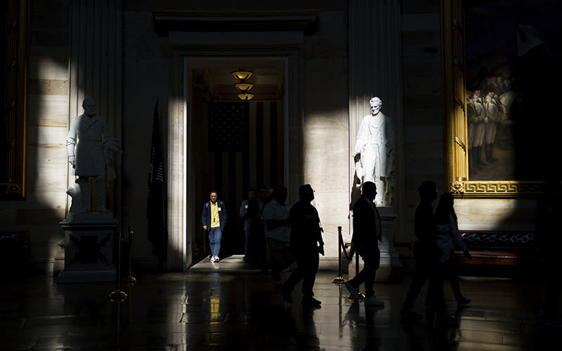 Tourists view the Capitol rotunda early in the morning