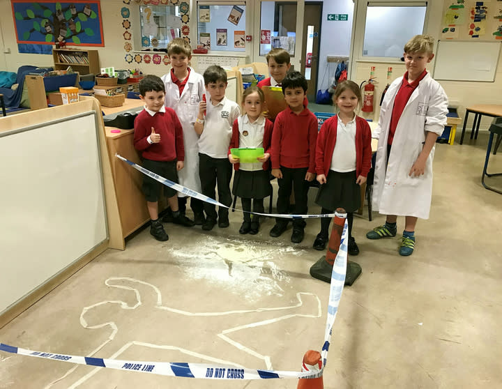 There's been a murder: Crime-solving pupils at Brooke Hall Academy (Picture: SWNS) 