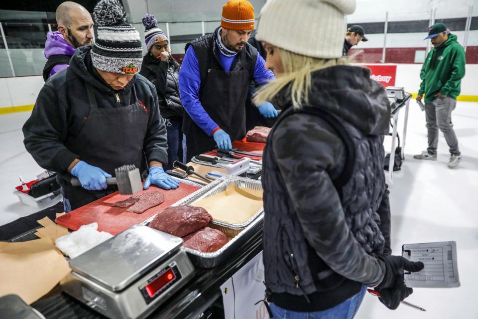 Jose Martinez, from Westland, competes along with 29 professional meat cutters from across Michigan and Indiana in the first round of the Texas Roadhouse Qualifier meat cutting challenge on the ice rink at Big Boy Arena in Fraser, Mich. on Tuesday, Sept. 19, 2023. Martinez qualified to continue on to the regional competition, which leads to the finals and a chance to win $25,000.