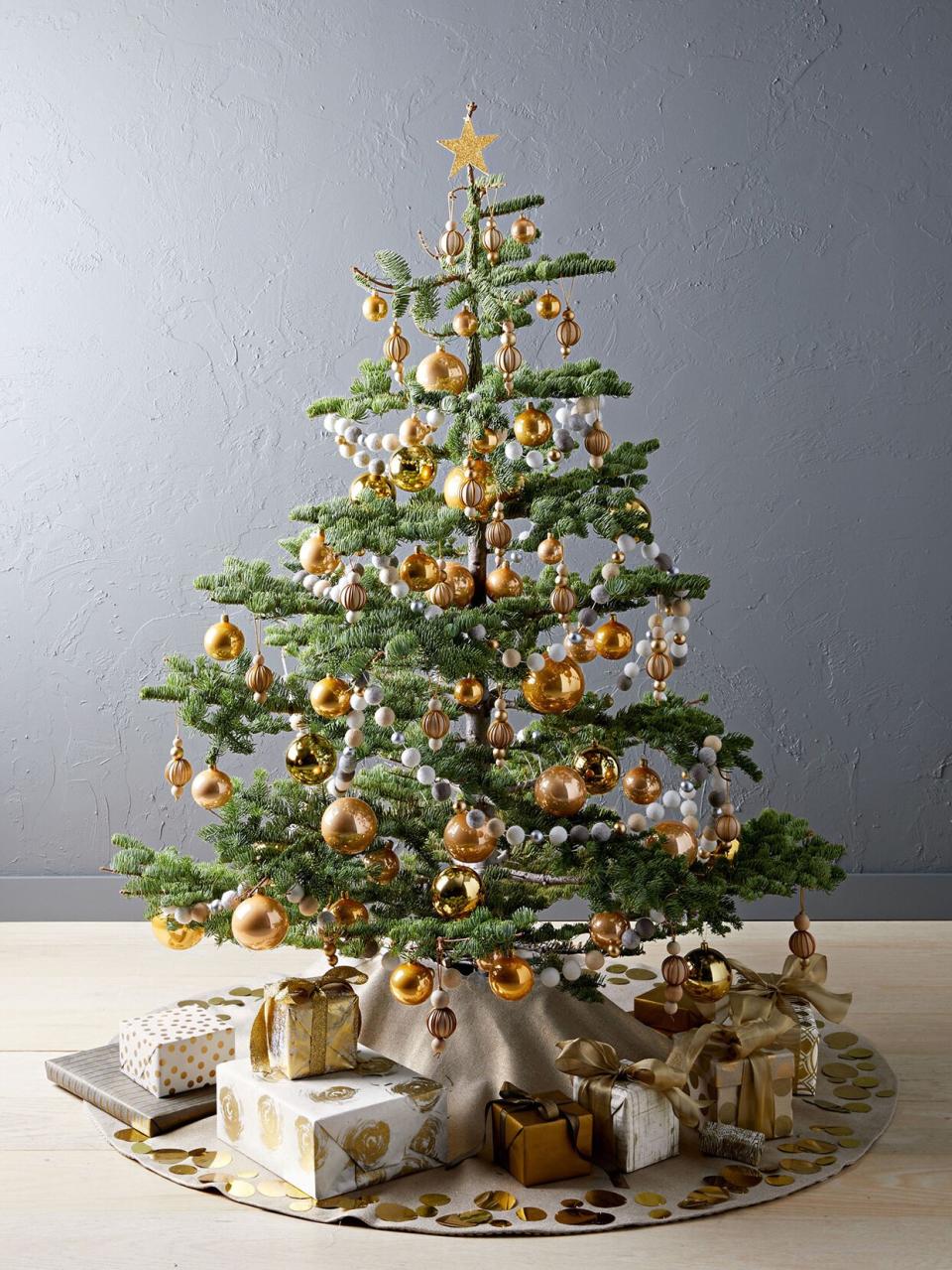 christmas tree decorated with golden ornaments