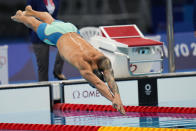 Caeleb Dressel, of United States, swims in a men's 100-meter butterfly semifinal at the 2020 Summer Olympics, Friday, July 30, 2021, in Tokyo, Japan. (AP Photo/Jae C. Hong)