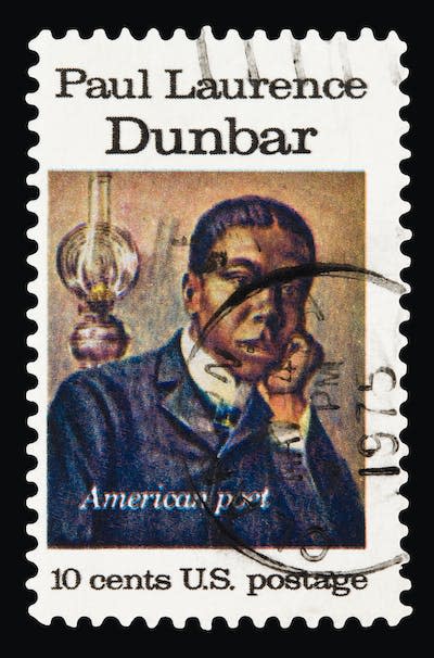 A U.S. postage stamp of Paul Laurence Dunbar issued in 1975. <a href="https://www.gettyimages.com/detail/photo/dunbar-1975-royalty-free-image/176786645?phrase=paul%20lawrence%20dunbar&adppopup=true" rel="nofollow noopener" target="_blank" data-ylk="slk:Lawrence Long/Getty Images;elm:context_link;itc:0;sec:content-canvas" class="link ">Lawrence Long/Getty Images</a>