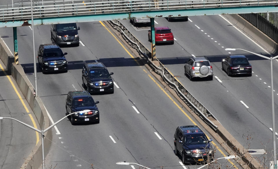 Former President Donald Trump's motorcade drives along a highway on its way to the courthouse on Tuesday.