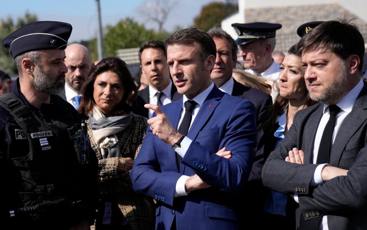 Emmanuel Macron, the French president, speaks with Benoit Payan, Marseille's mayor, on Tuesday after a Monday night meeting of ambassadors in Brussels