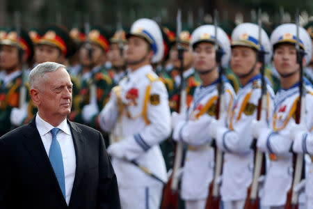 U.S. Secretary of Defense Jim Mattis reviews the guard of honour during a welcoming ceremony in Hanoi, Vietnam January 25, 2018. REUTERS/Kham